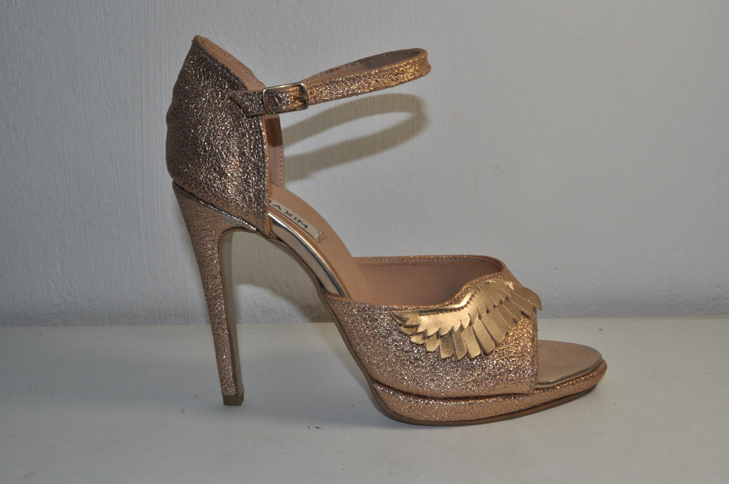 “Women’s Gold High Heel Sandals with Angel Wings Detail – Chic Luxury Evening Heels”